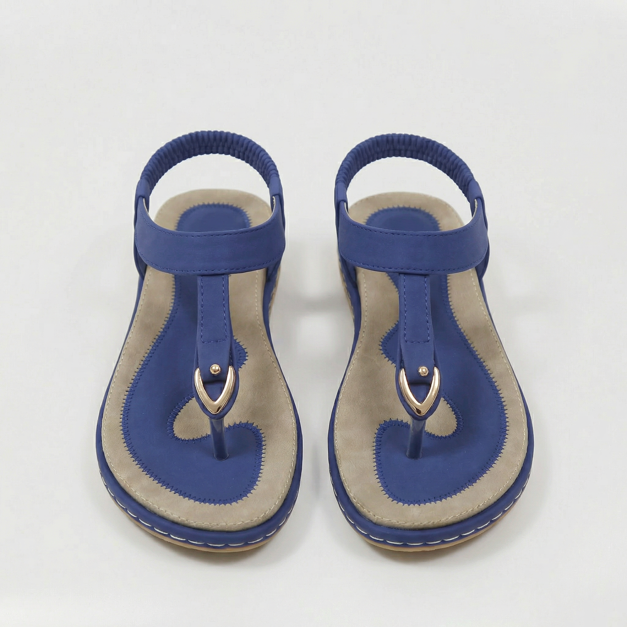 Sandales plates pour femme avec bride élastique et ornement métallique